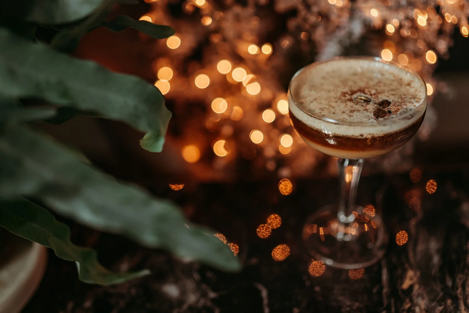 Gin cocktail served at festive afternoon tea with Christmas lights at Downham Hall Essex