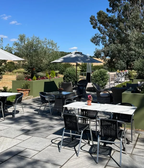 Corporate guests enjoying a crazy golf activity on the manicured lawn at Downham Hall in Essex.
