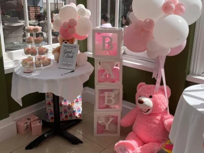 baby shower setup at Downham Hall Orangery Essex with balloons decorations and afternoon tea
