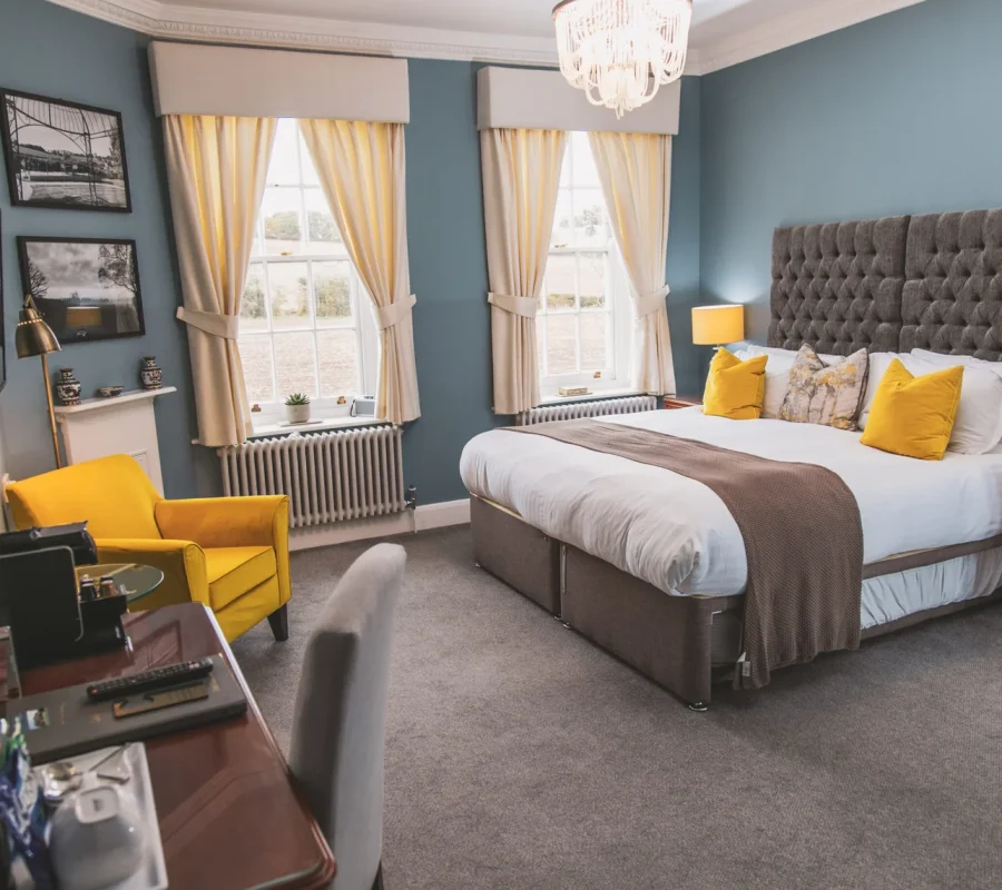 Luxury double bedroom with elegant decor at Downham Hall wedding venue Essex